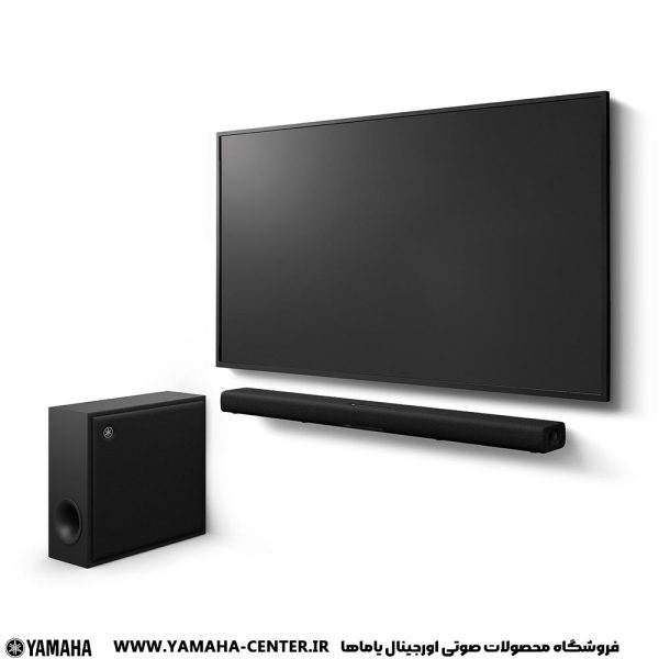 ساندبار مشکی یاماها SR-X50A به همراه ساب‌ووفر، زیر تلویزیون دیواری قرار گرفته است.